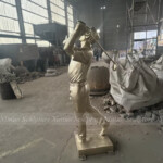 bronze golfer statue
