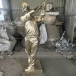 bronze golfer statue