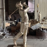 bronze golfer statue